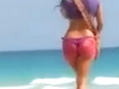 Hot college girl in thong bikini at the beach