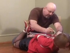 Girl with red blouse hogtied and gagged