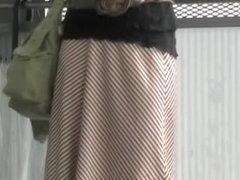 Asian babe has her long skirt torn by a street sharker.