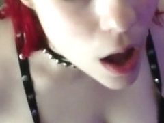 Sexy redhead gags on a big cumshot