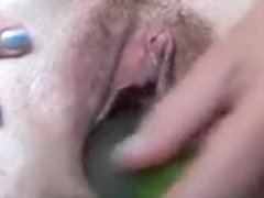 Dirty loose shaved pussy of my mature wife inserted with a cucumber
