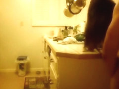 Moaning brunette gets doggystyle fucked in the kitchen