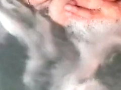 Tit play in hot tub