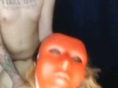 Girl with funny mask blows her boyfriend