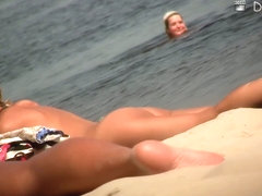 Skinny young girls with naked tits caught on the spy beach cam
