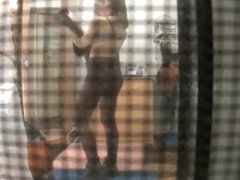 Spy camera catches neighbor in her bedroom undressing