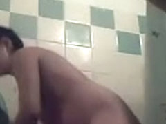 A sexy woman takes a shower for the hidden camera