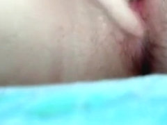 girl fingers her pussy closeup on her bed and gets super wet