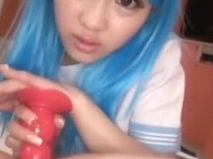 Cute Asian blue hair shove a red toy up guy pooper