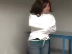 Cute barefoot girl escapes from straitjacket bondage