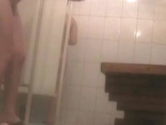 Fem with cool hips soaping skin on the shower cam