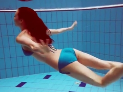 Redhead In Blue Bikini Showing Her Body