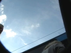 Bimbo blonde with white panties gets on a bus in an upskirt porno