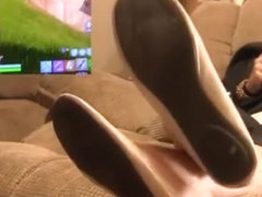 Playing Fortnite and showing feet soles and shoes soles