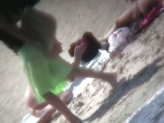 Nude blonde babe sunbathing at the beach spy cam video