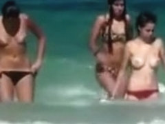 Topless girls running in the water