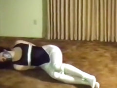 Woman tied in Black Leotard and White Tights