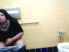 Lovely Brazilian fattie gets recorded urinating hard in a public restroom
