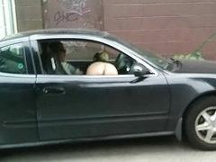 Naked hooker gives blowjob in the car and gets filmed
