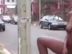 Black babe teases her cunt on the street