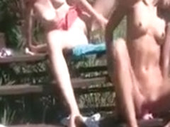 Naked Natasha dildoing her lesbo twat outdoor