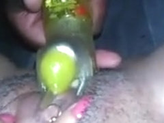 Nasty black girl plays with her pierced pussy and dildo