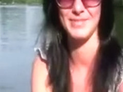 Pretty chick goes on small boat with two dudes in park