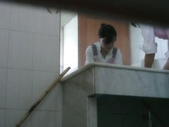 Toilet spy camera catches a cute Asian chick taking a piss.