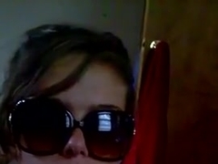 Cute girl in big sunglasses enjoys a black dick.