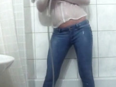 Wetlook pissing and showering jeans