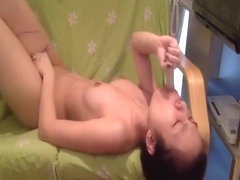 asian licking a dildo before jamming it deep in her pussy
