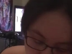 Asian girlfriend with glasses deep throats massive cock