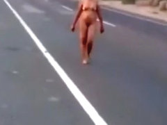 Latina girl walking nude by the road