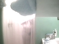 An alluring bimbo caught on a spy cam in the shower