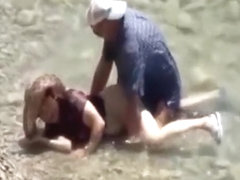 Voyeur captures a couple having sex in the sea