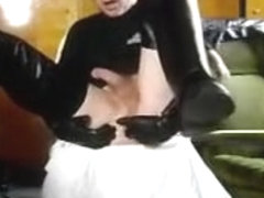 Leather dude fingers his ass