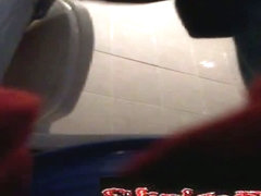 A woman takes a sensual piss while filmed by a hidden video camera