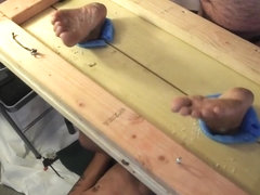 Hot wax dripped on dirty soles in stocks