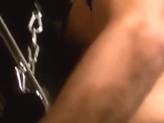 Hairy Leather Daddy fucks boy in a sling