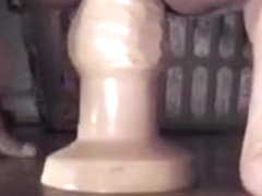 Experienced ass takes huge toy