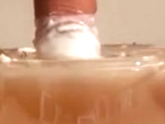 Jerking some cum in a bowl of wax