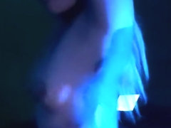 Hot Latina shaking her ass in blue light to techno music, twerking her ass