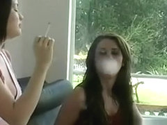 This slut shows her huge bust while holding a cigarette