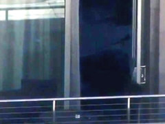 Sexy guy at the hotel balcony