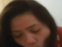 Cute smilling oriental hottie gives head