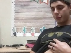 Sexy stud playing with himself in the office