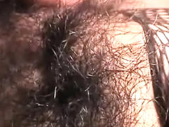 Japanese cutie in fishnets has a cock and a sex toy pleasing her pussy