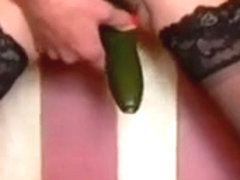 Ravishing latino cookie copulates herself with a cucumber for the camera
