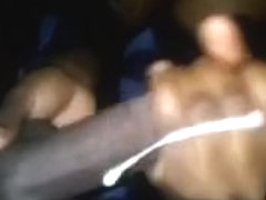 Busty black girlfriend jerking off my big black dick on cam