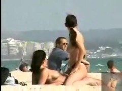 Hidden cam clip with two busty brunettes going lesbian on a nude beach